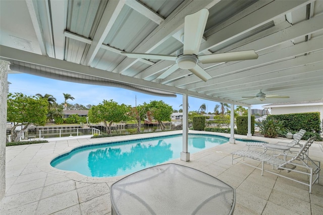 view of swimming pool with a patio and ceiling fan