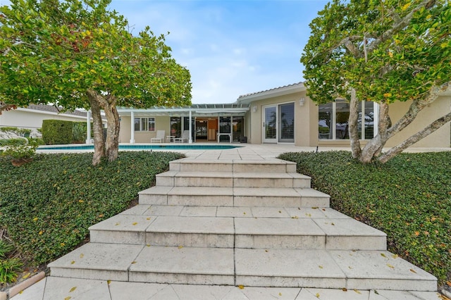 back of house featuring a patio area