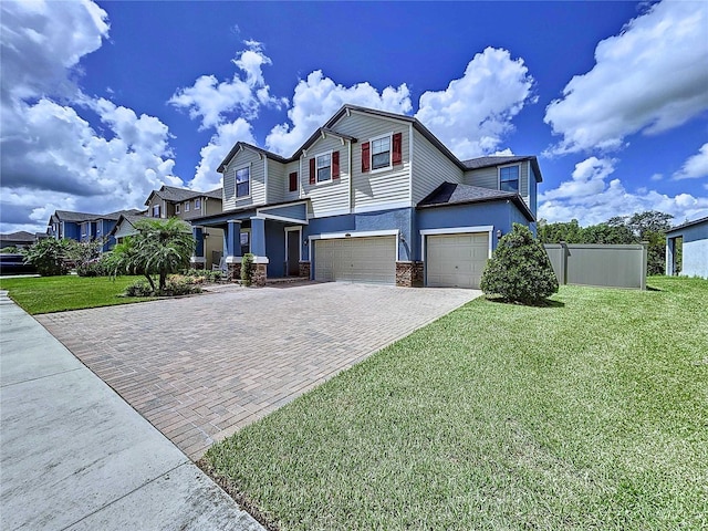 view of front of house featuring a front yard and a garage