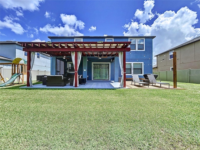 back of property featuring a lawn, an outdoor living space, a patio area, and a playground