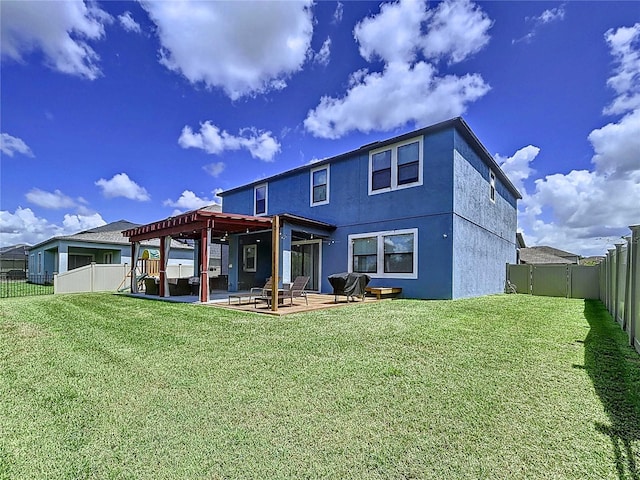 back of house featuring a lawn, a pergola, and a patio