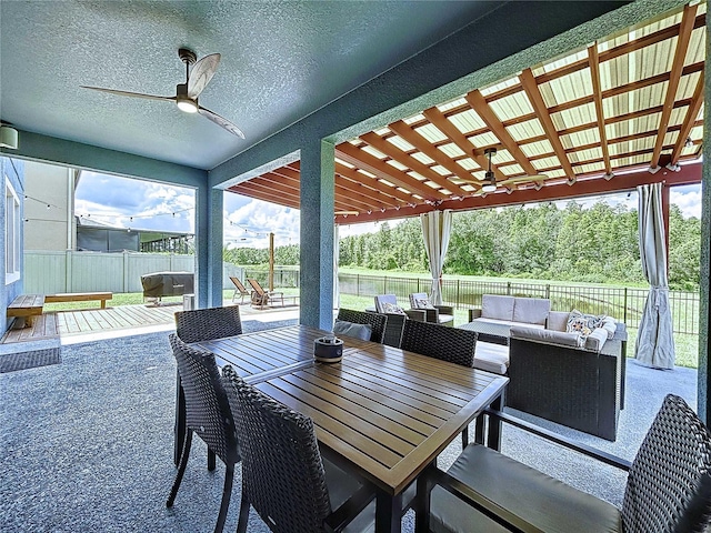 view of patio / terrace with a pergola, ceiling fan, and an outdoor living space