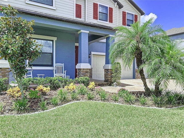 doorway to property with a garage