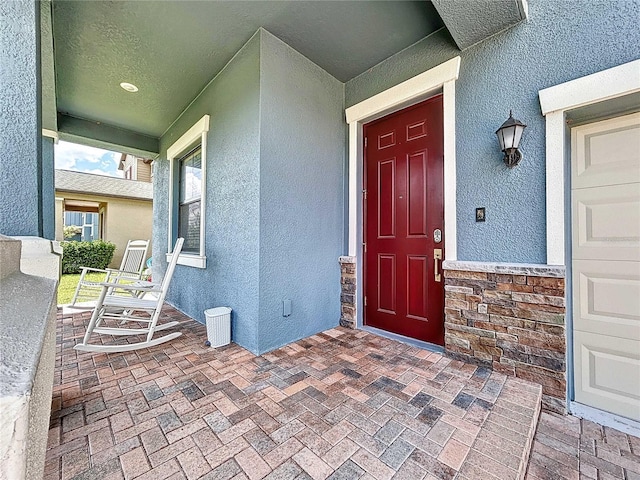 entrance to property with covered porch