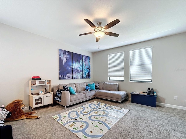 carpeted living room featuring ceiling fan