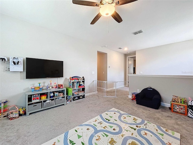 rec room featuring carpet flooring and ceiling fan