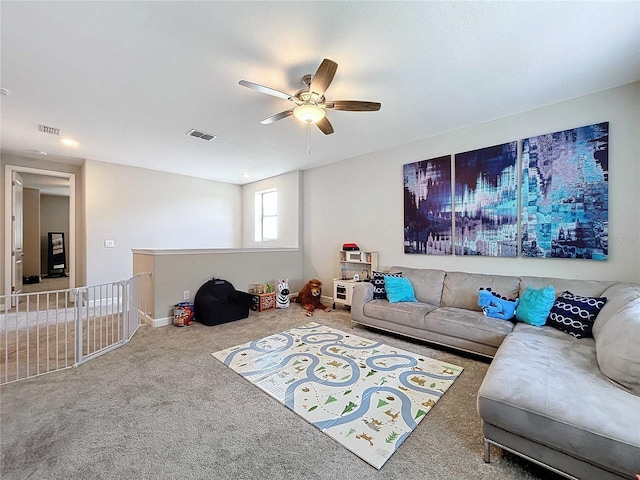 living room featuring carpet flooring and ceiling fan