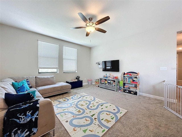 living room featuring carpet flooring and ceiling fan