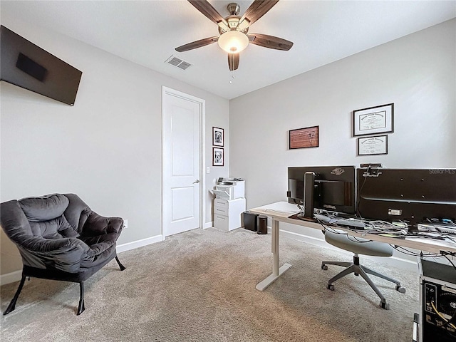 carpeted office with ceiling fan