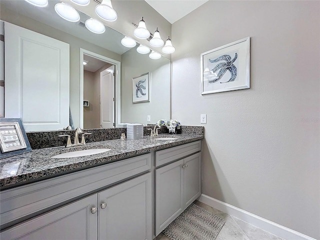 bathroom with tile patterned flooring and vanity