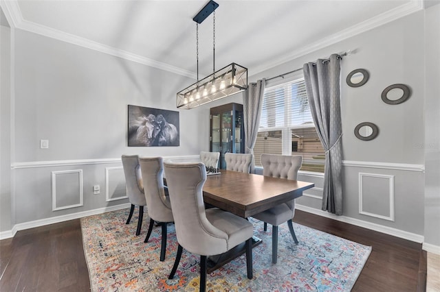 dining area featuring ornamental molding and dark hardwood / wood-style floors