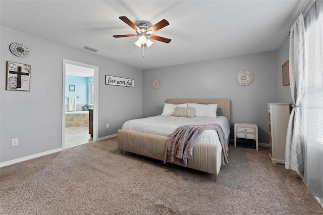 bedroom featuring ensuite bathroom, ceiling fan, and carpet