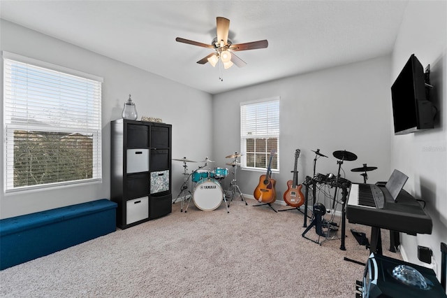 recreation room featuring carpet floors and ceiling fan