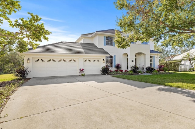 view of front of property with a garage and a front yard