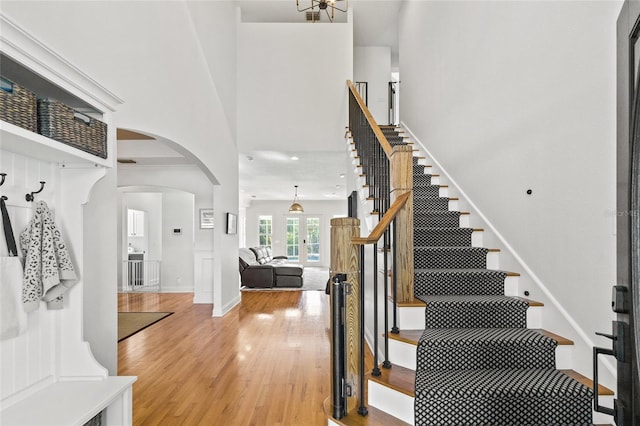 staircase with hardwood / wood-style floors