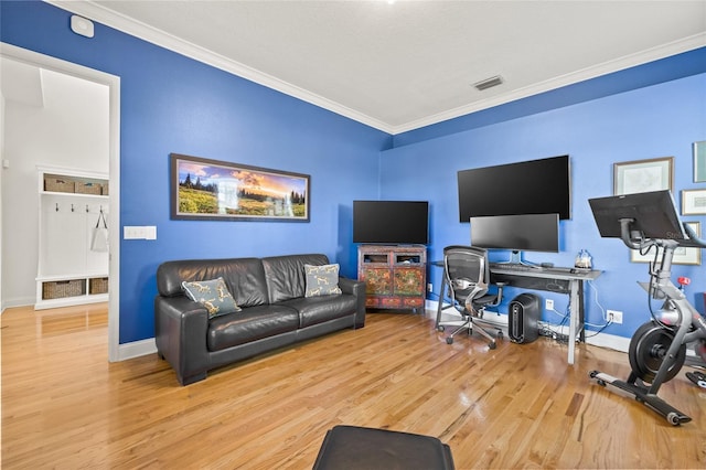 living room featuring light wood-type flooring and ornamental molding