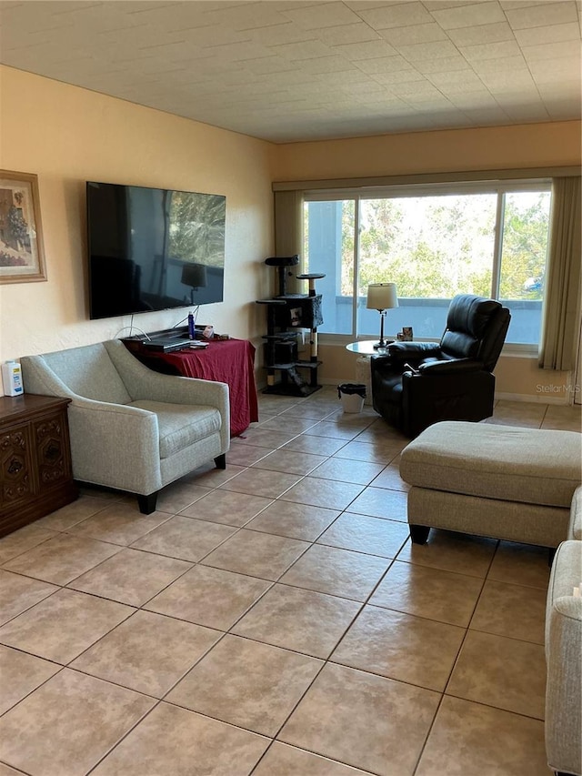 tiled living room with a healthy amount of sunlight