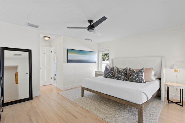 bedroom featuring wood-type flooring and ceiling fan