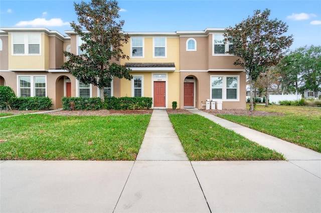 view of property featuring a front yard