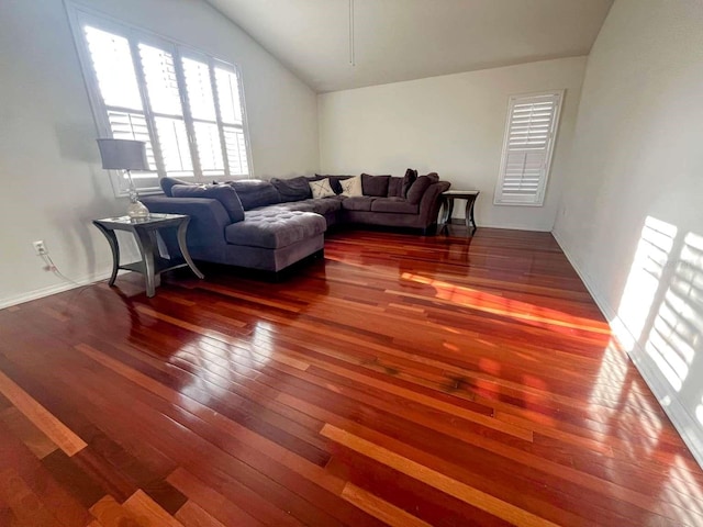 living room featuring wood-type flooring and lofted ceiling