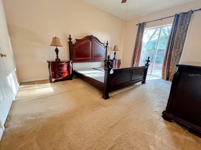 carpeted bedroom featuring access to exterior and ceiling fan