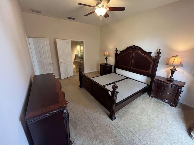 bedroom featuring ceiling fan and light carpet