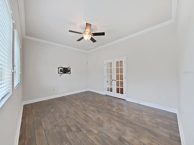 empty room with french doors, hardwood / wood-style flooring, ceiling fan, and crown molding