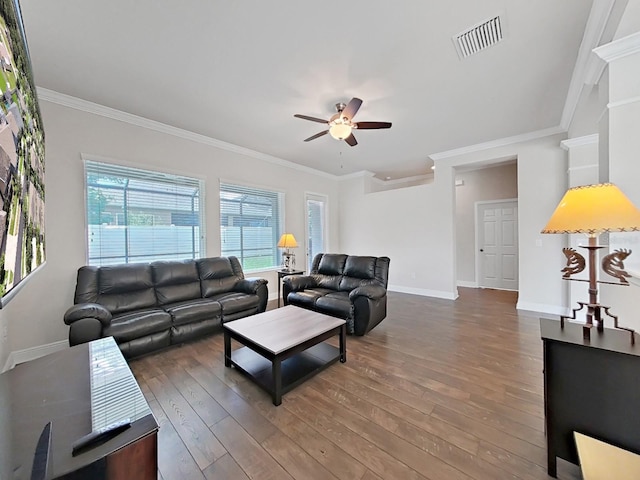 living room featuring ceiling fan, wood-type flooring, and ornamental molding