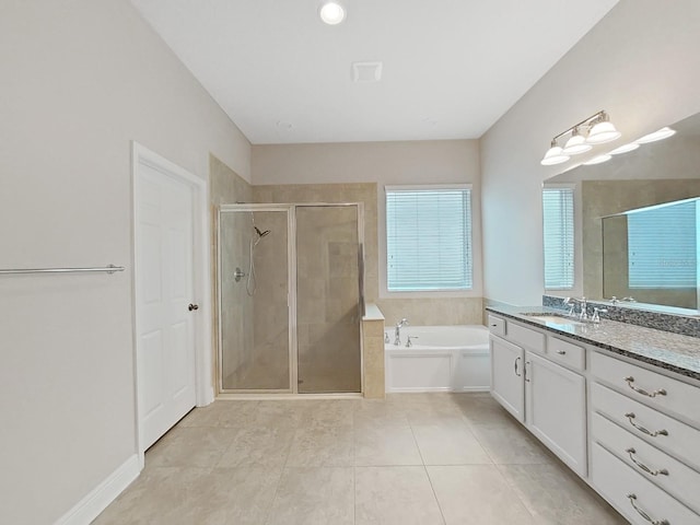 bathroom with tile patterned floors, vanity, and separate shower and tub