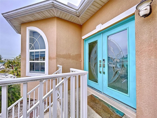 doorway to property with french doors and a balcony