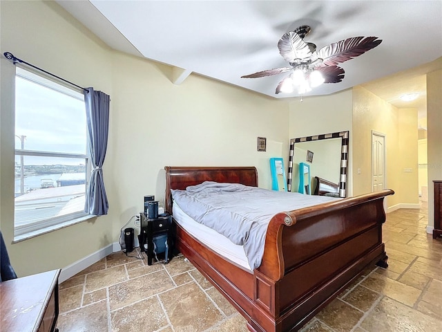 bedroom with ceiling fan and a closet