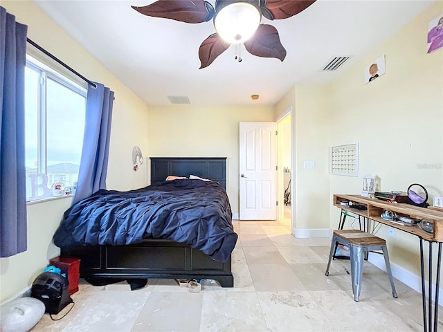 tiled bedroom with ceiling fan