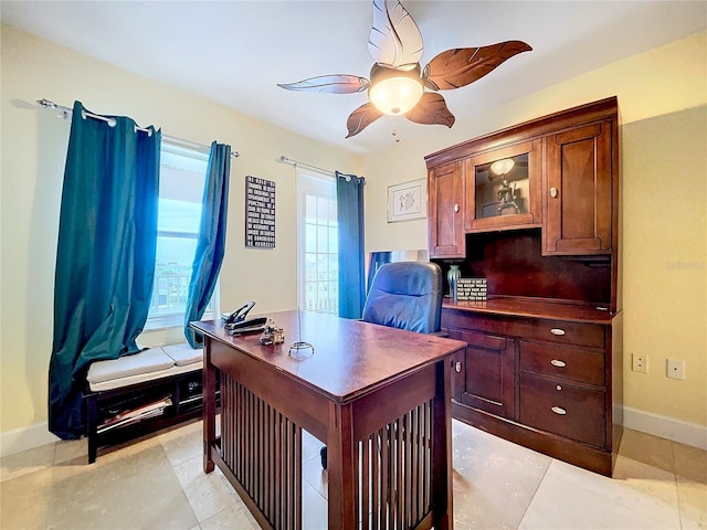 tiled home office with ceiling fan