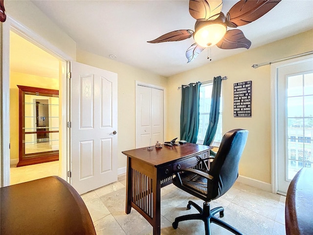 office with light tile patterned flooring and ceiling fan