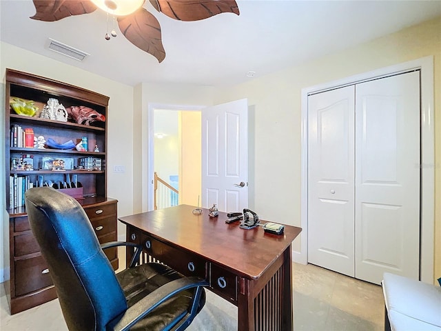 tiled office featuring ceiling fan