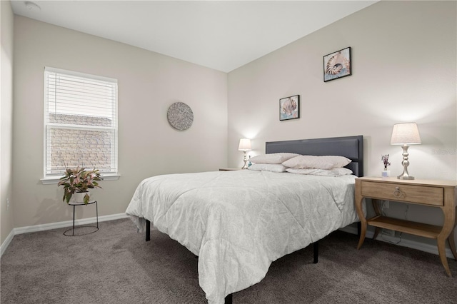 bedroom with carpet flooring and multiple windows