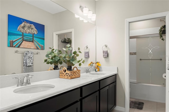 bathroom featuring tile patterned flooring, vanity, and washtub / shower combination