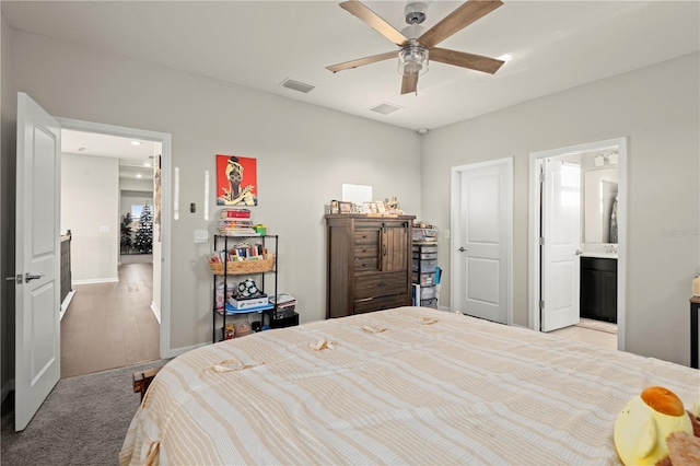 bedroom with ceiling fan and connected bathroom