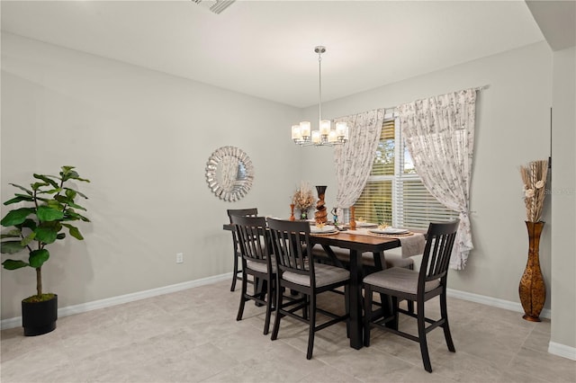 dining room with a chandelier