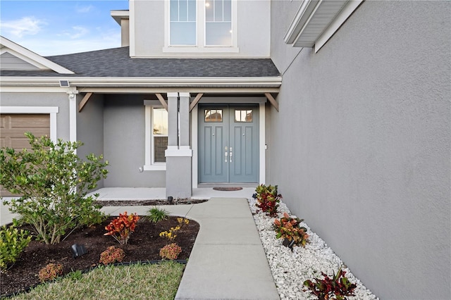 view of exterior entry with a porch