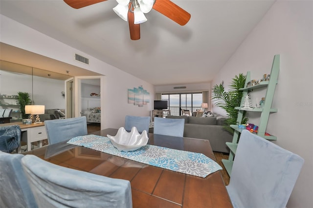 dining area with ceiling fan and hardwood / wood-style flooring