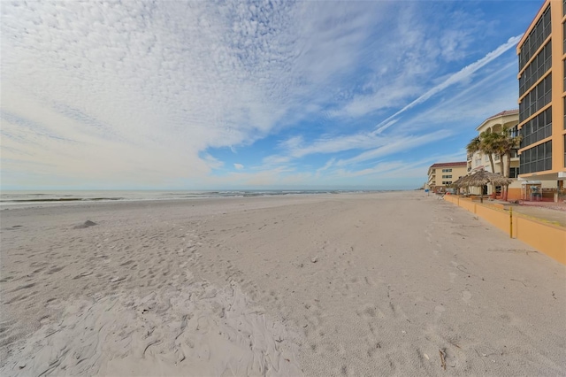 exterior space with a beach view and a water view