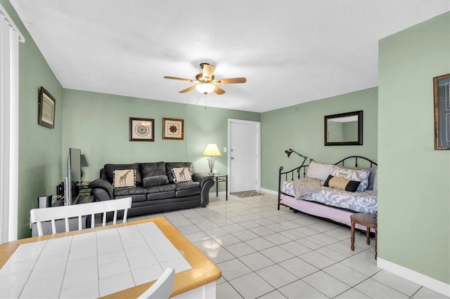 tiled living room with ceiling fan