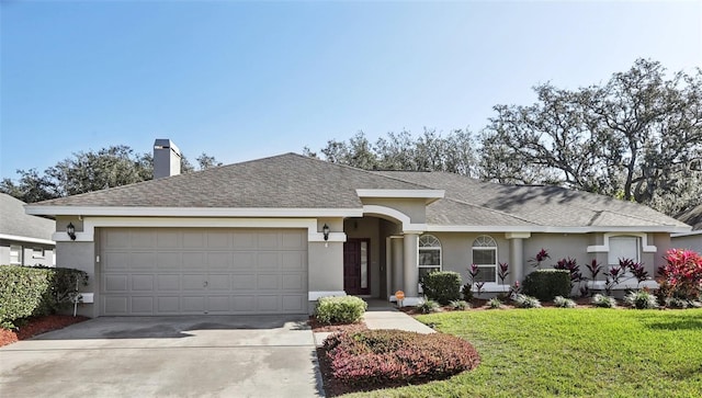 ranch-style house with a garage and a front lawn