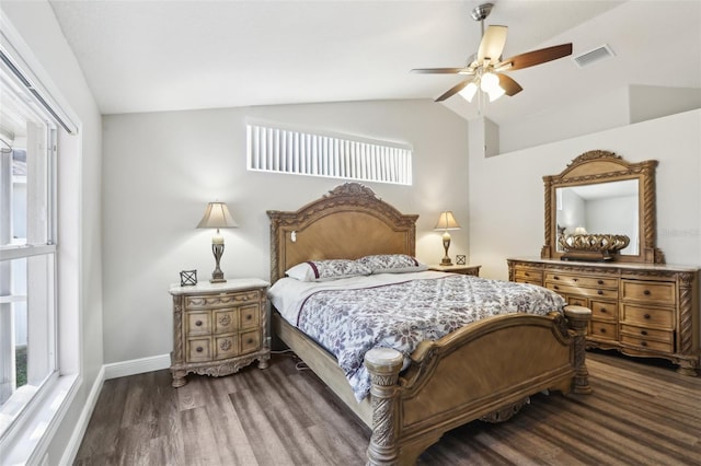 bedroom with lofted ceiling, ceiling fan, dark hardwood / wood-style flooring, and multiple windows