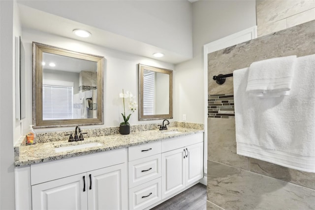 bathroom with hardwood / wood-style flooring and vanity