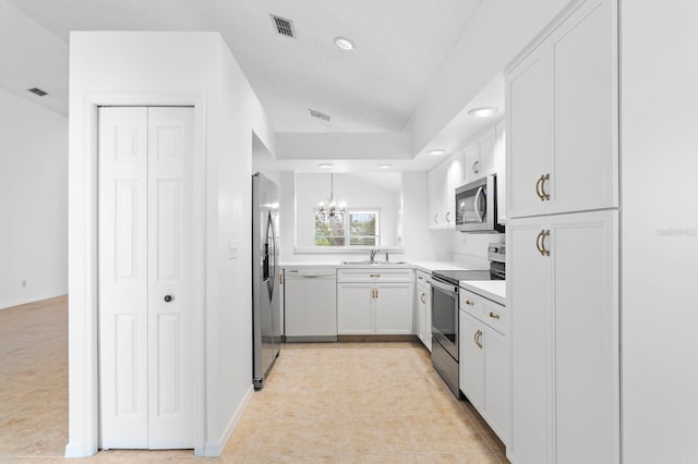 kitchen featuring sink, white cabinets, lofted ceiling, a notable chandelier, and appliances with stainless steel finishes