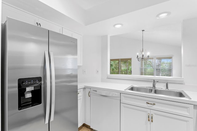 kitchen with sink, stainless steel fridge with ice dispenser, white cabinetry, and dishwasher