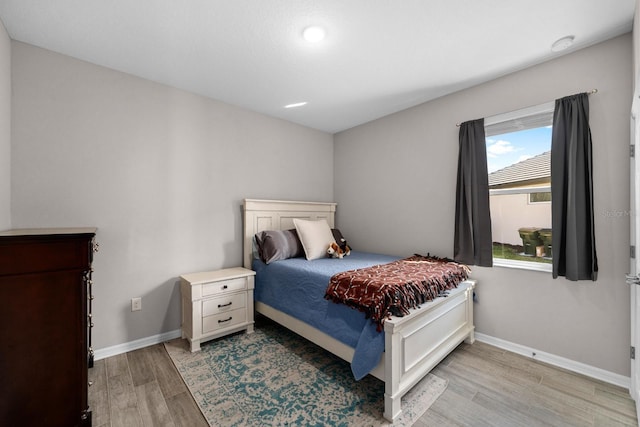 bedroom with light hardwood / wood-style flooring