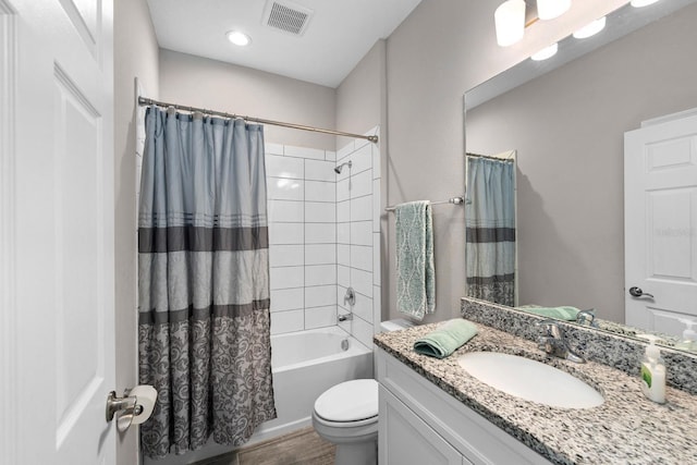 full bathroom with vanity, toilet, and shower / bath combo with shower curtain